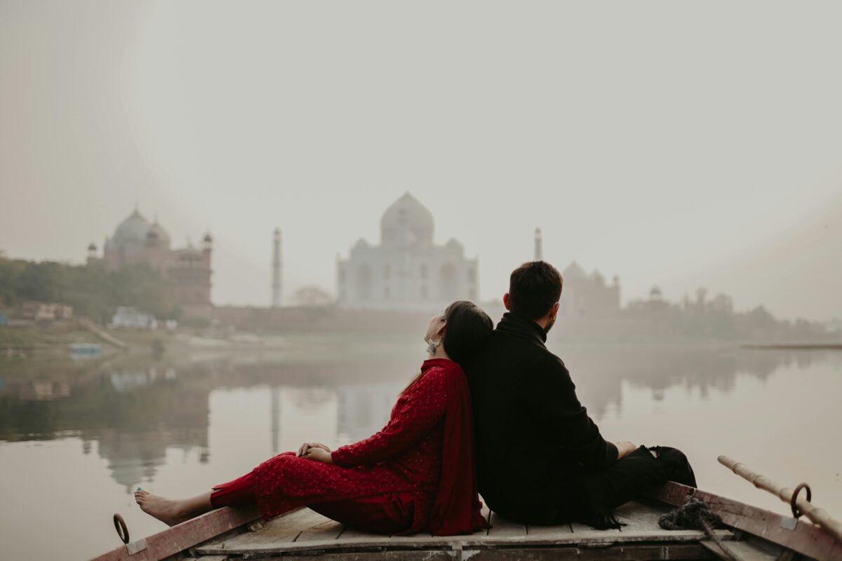 Traveler joyfully embracing the moment in front of an iconic Indian location