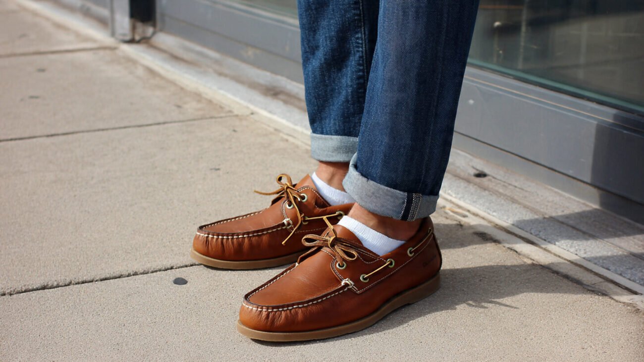 tan boat shoes with blue jeans and