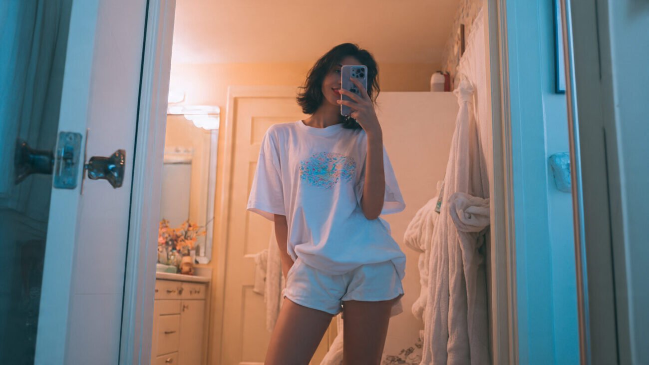 a girl wearing an oversized tee with